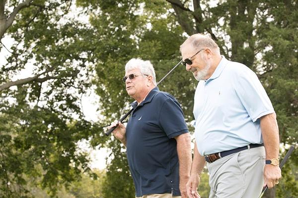 man holding golf club